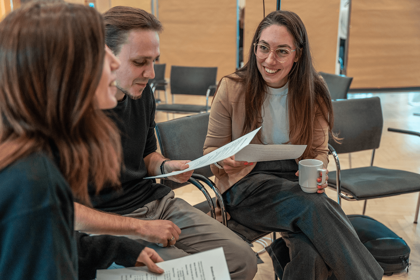 fiskaly team at the Growth Summit, chatting with each other, workshop setting