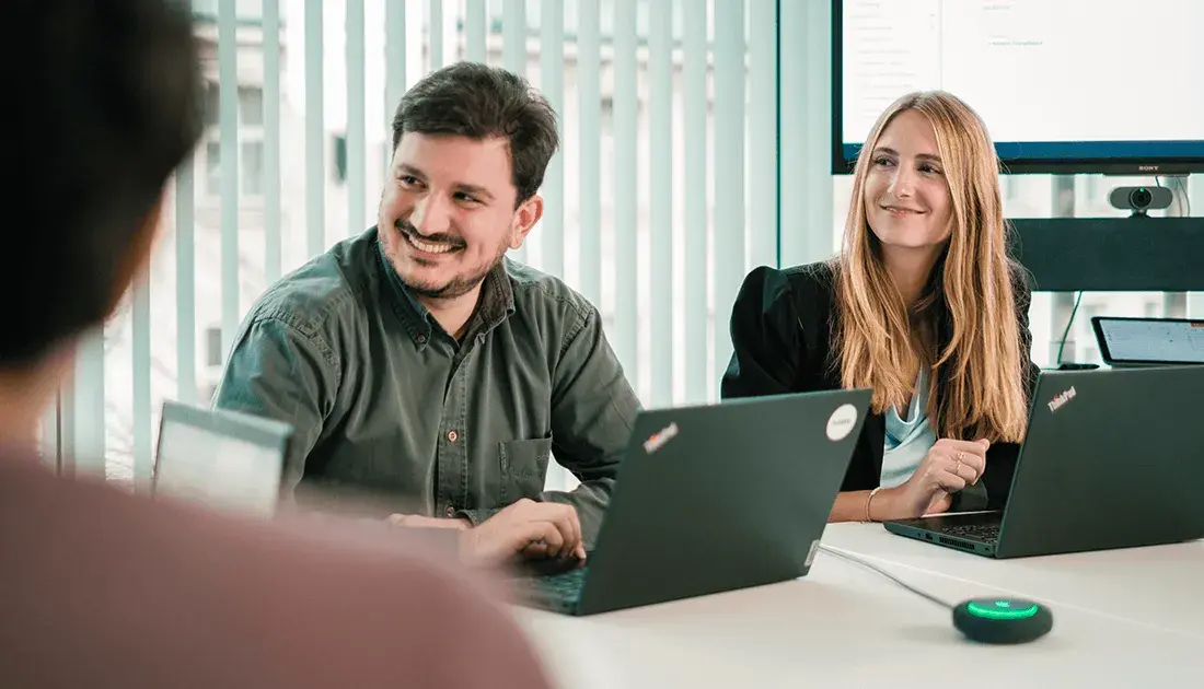 fiskaly workers smiling in a fiscal compliance consultancy session
