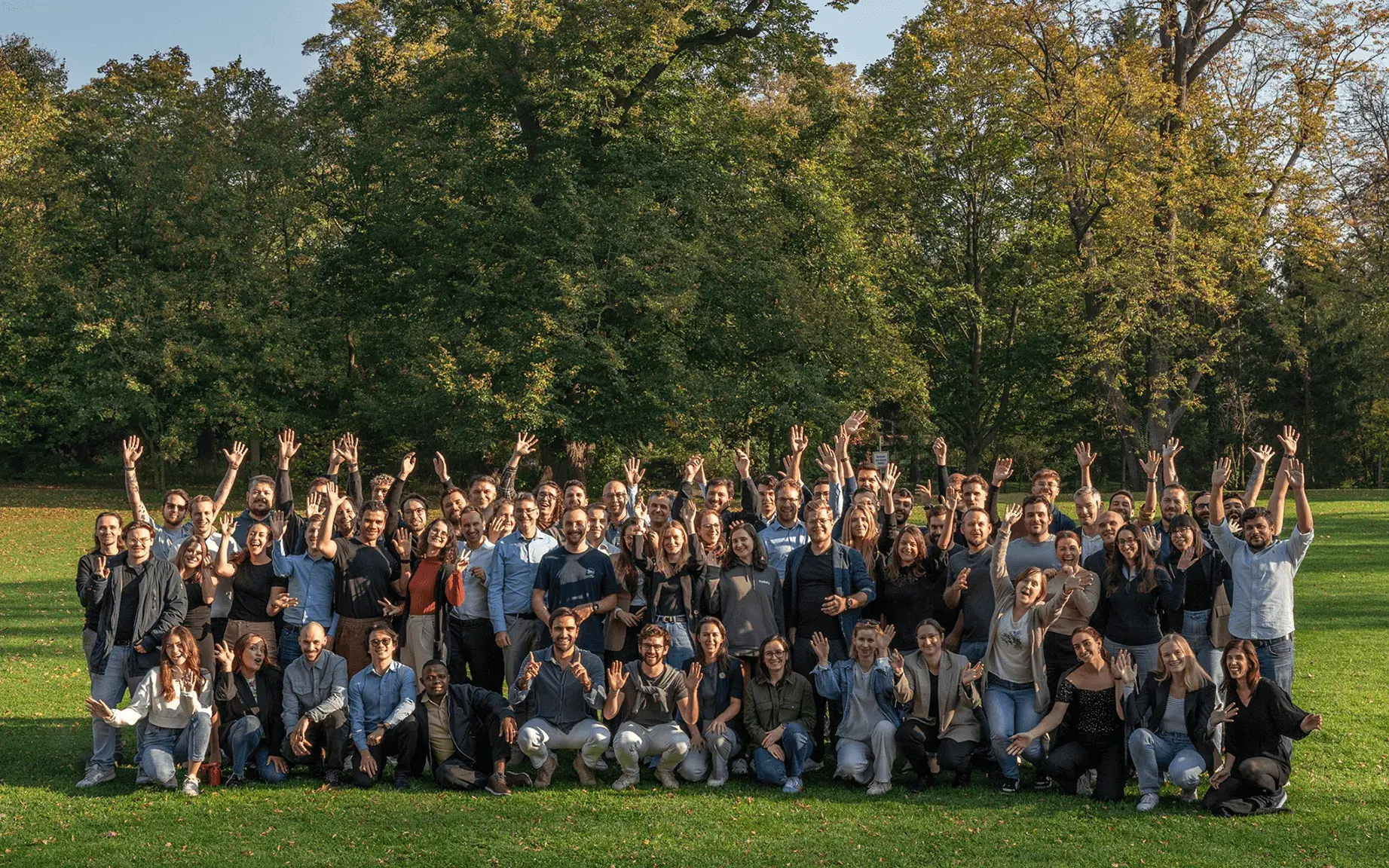 The whole fiskaly team together, including fiskaly employees, management and C level with Great Place to Work 2024 2025 badge
