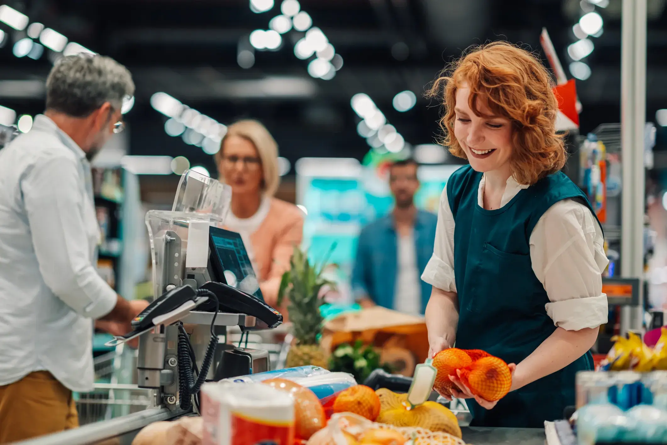cashier at a supermarket checkout