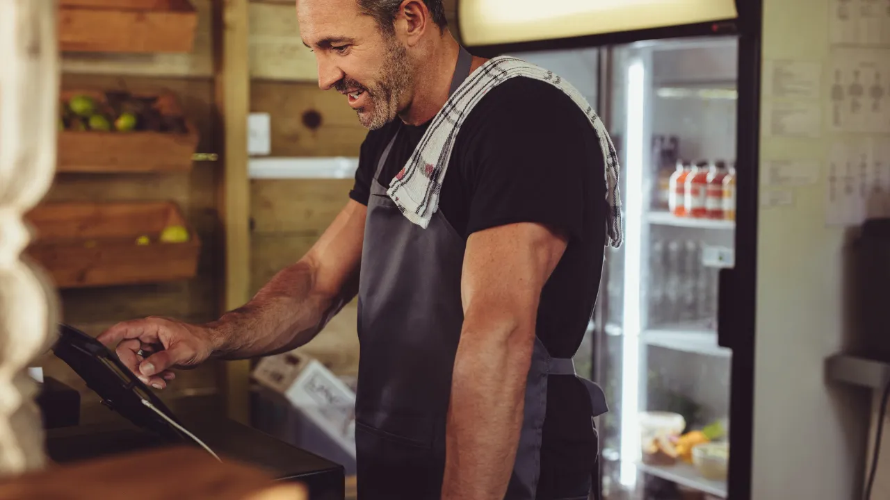 A merchant using a PoS