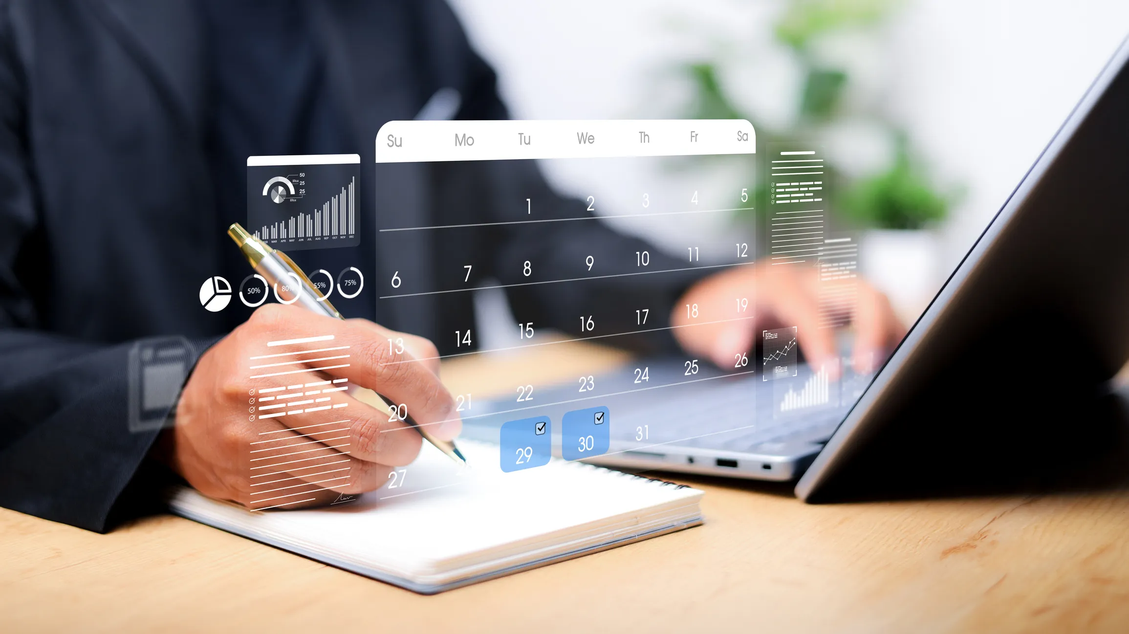 Person typing on laptop and calendar